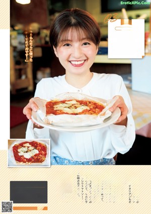 A woman sitting at a table with a plate of food and a drink.