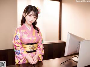 A woman in a kimono sitting on a window sill.