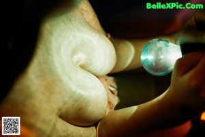 A person holding a light bulb in their hand.