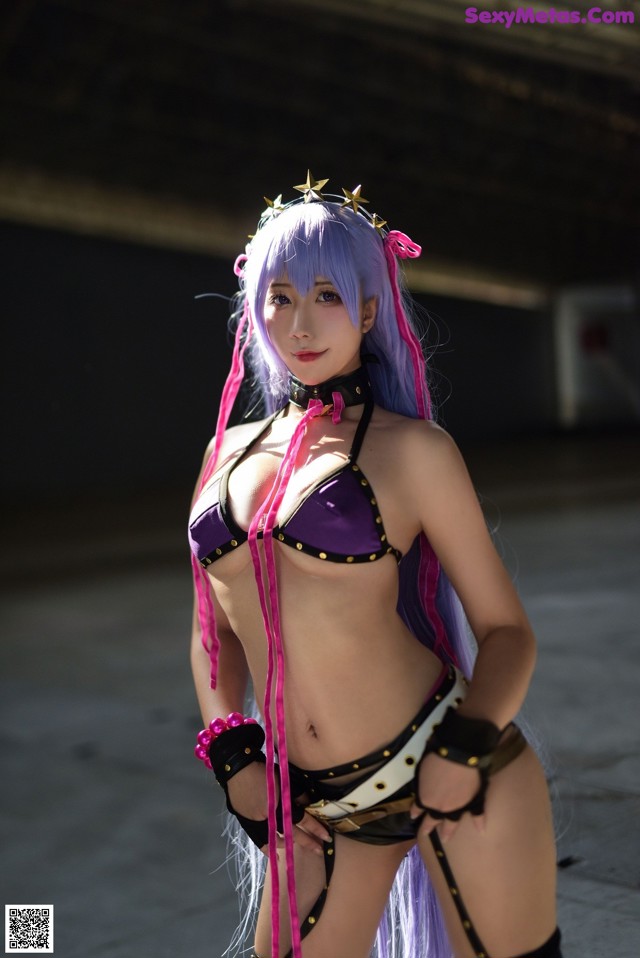 A woman in a bikini with purple hair and a crown on her head.