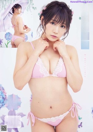 A woman in a bikini posing for a picture.