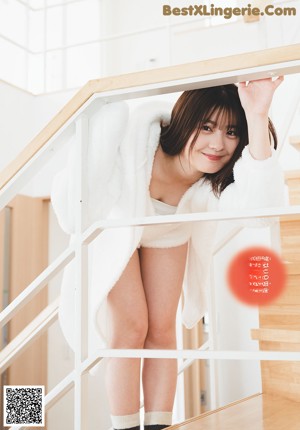 A magazine with a girl in a school uniform on the cover.