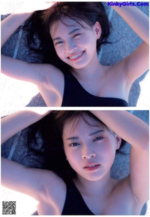 A young woman laying on the edge of a swimming pool.