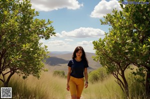 A woman wearing a beige skirt with a high low hem.