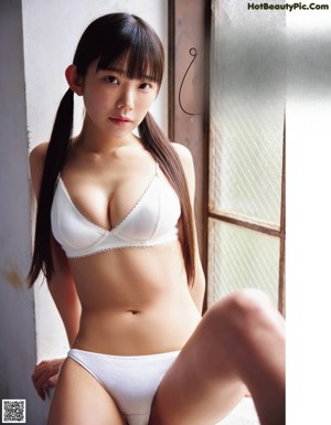 A woman in a bikini posing for a magazine.